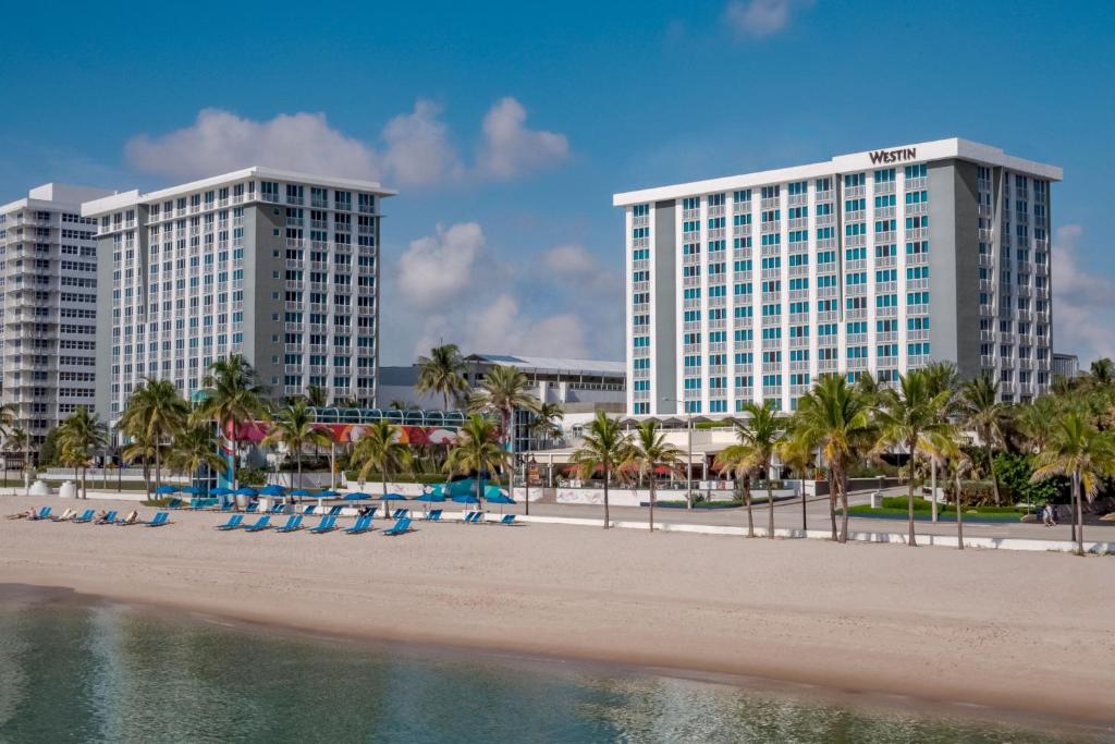The Westin building with beach and beach chairs in front, Fort Lauderdale