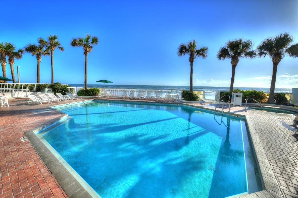 Outdoor pool facing the ocean at Bahama House Daytona Beach Shores Hotel