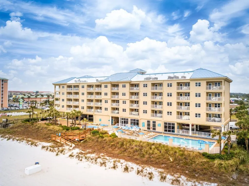 Aerial view of Holiday Inn Club Vacations building, outdoor pool, and beach, in Panama City Beach