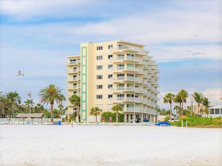 Jamaica Royal Beachfront by Beachside Management stands by Crescent Beach in Siesta Key