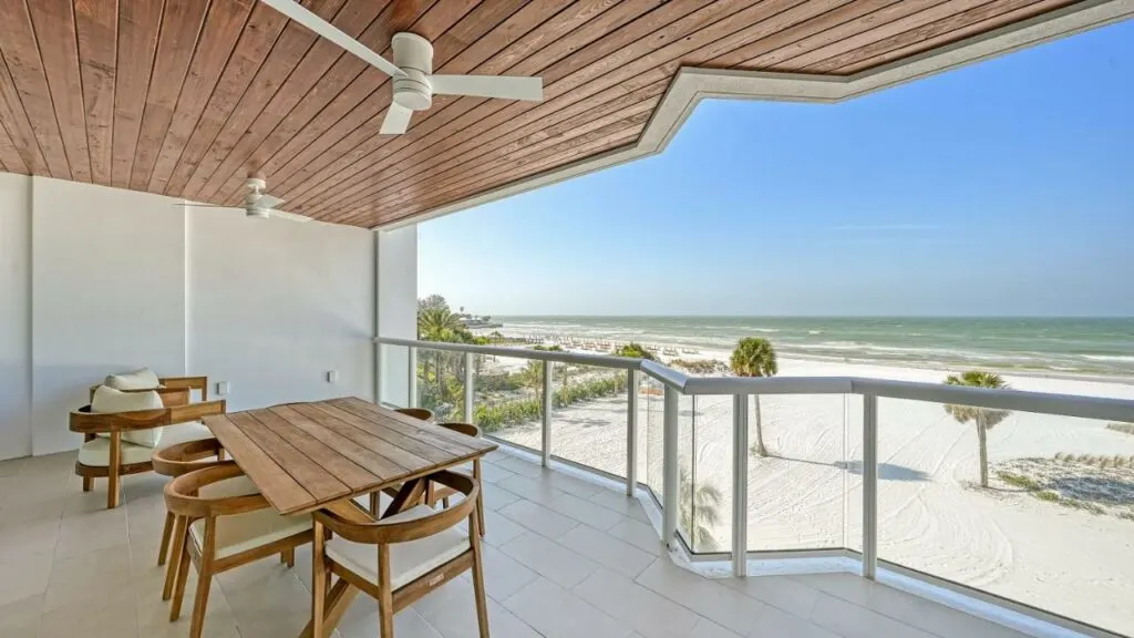 View of the beach and sea from a balcony at Ten35 Seaside Rentals in Siesta Key