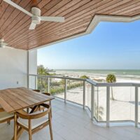 View of the beach and sea from a balcony at Ten35 Seaside Rentals in Siesta Key