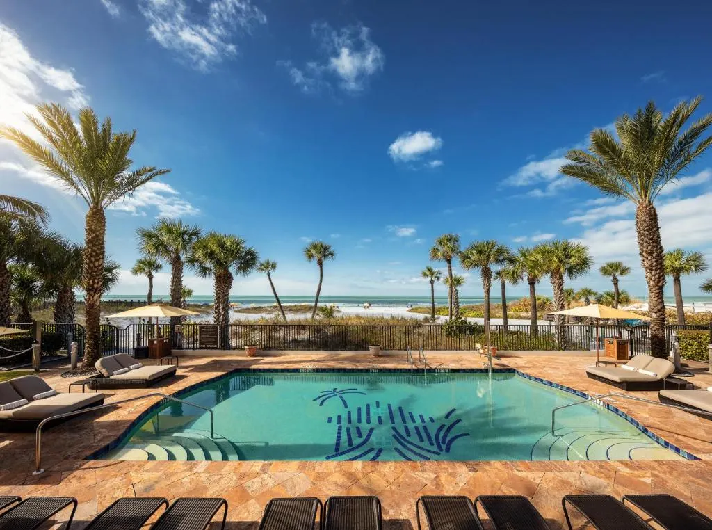 View of the outdoor pool and beach at The Residences on Siesta Key Beach in Siesta Key