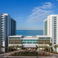 The ocean sits behind the Wyndham Grand Hotel in Clearwater Beach, Florida